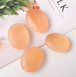 Orange selenite palmstone