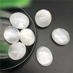 Oval shape selenite palm stone