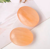 Orange selenite palmstone