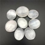 Oval shape selenite palm stone