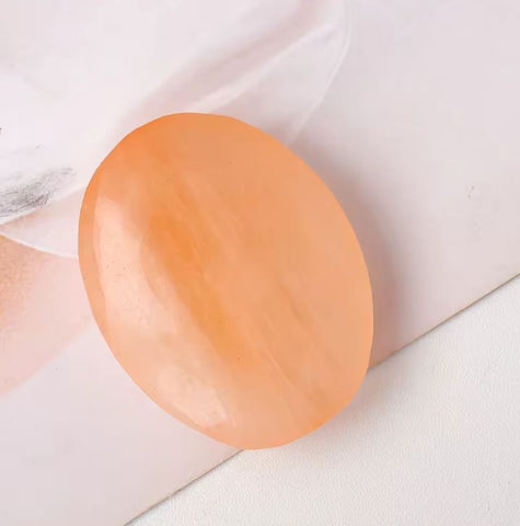 Tumbled orange selenite stone