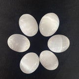 Silver selenite palm stone