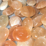 Orange selenite palm stone