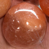 Peach selenite sphere